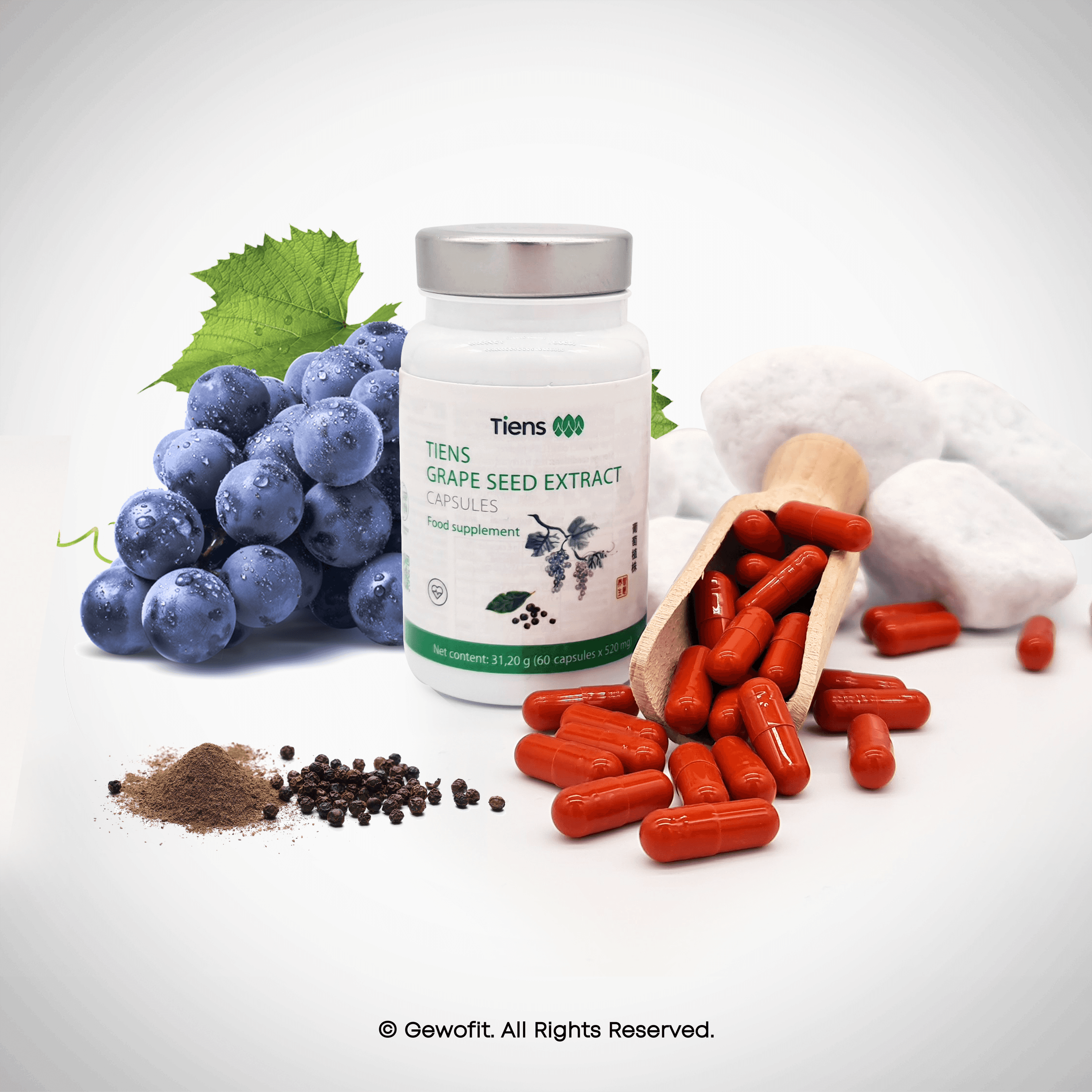 a bottle of grape seed extract next to a pile of grapes